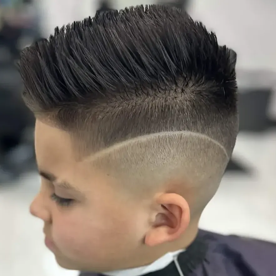 Modern textured crop with mid skin fade at Next Level Barber Shop